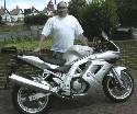 My gorgeous Silver SV650s, complete with lower fairing, braided hoses, rear rack, dubble bubble screen, etc. Unfortunately, nice sporty bikes and large balding fat men do not get on, so I had to sell her, but she looked great...